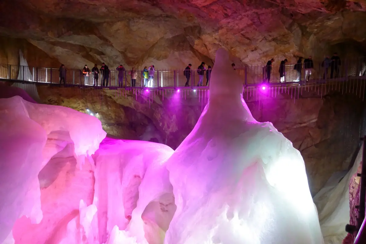 Illuminated ice and the suspension bridge in the Dachstein Giant Ice Cave