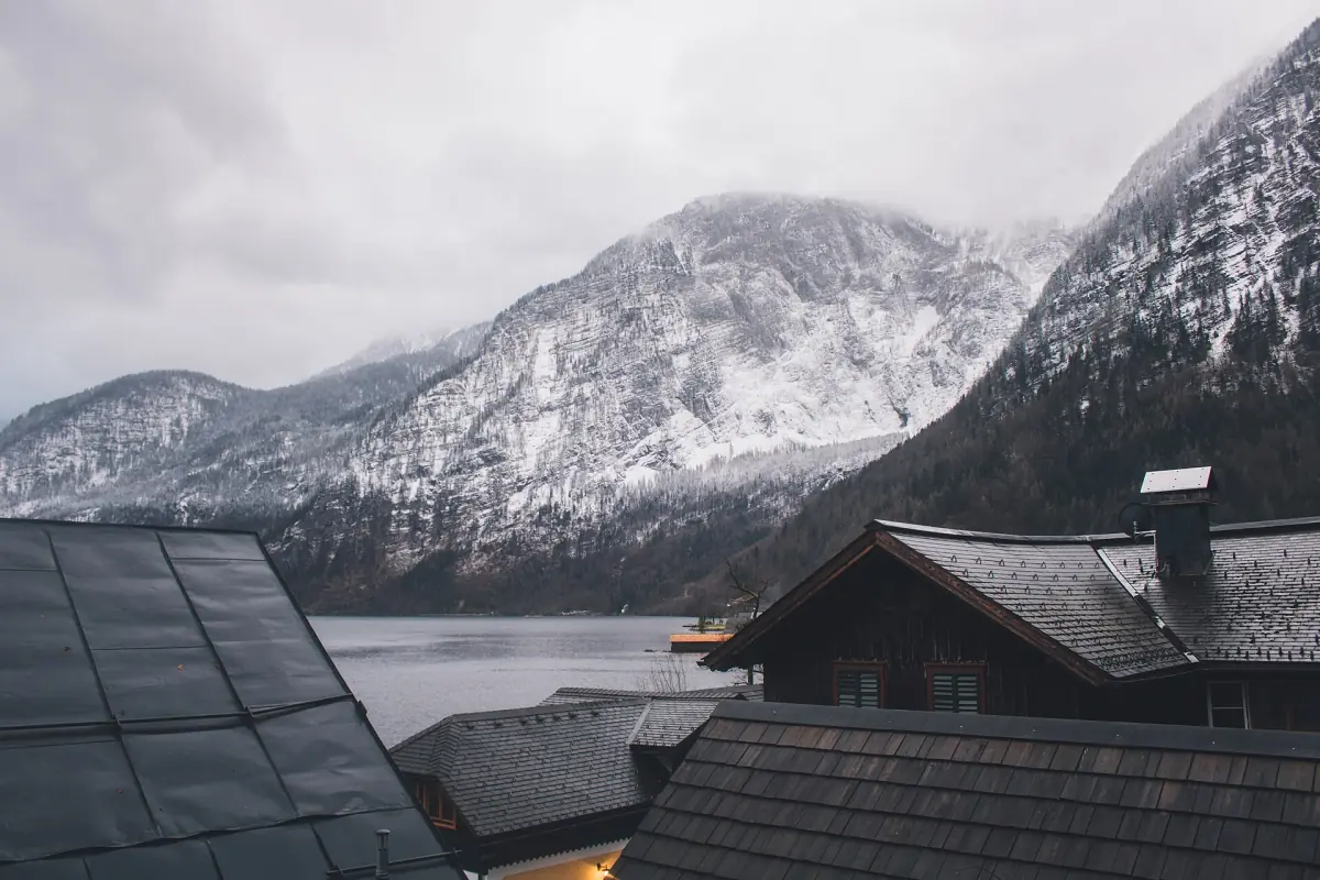 Snow on the mountains above the rooftops of Hallstatt in winter
